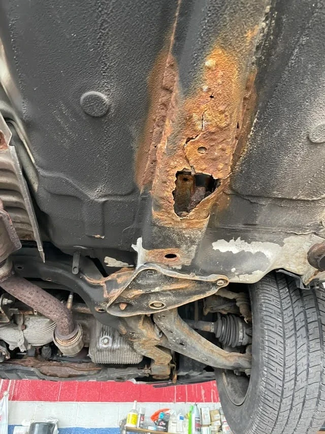 (Trou causé par la rouille)